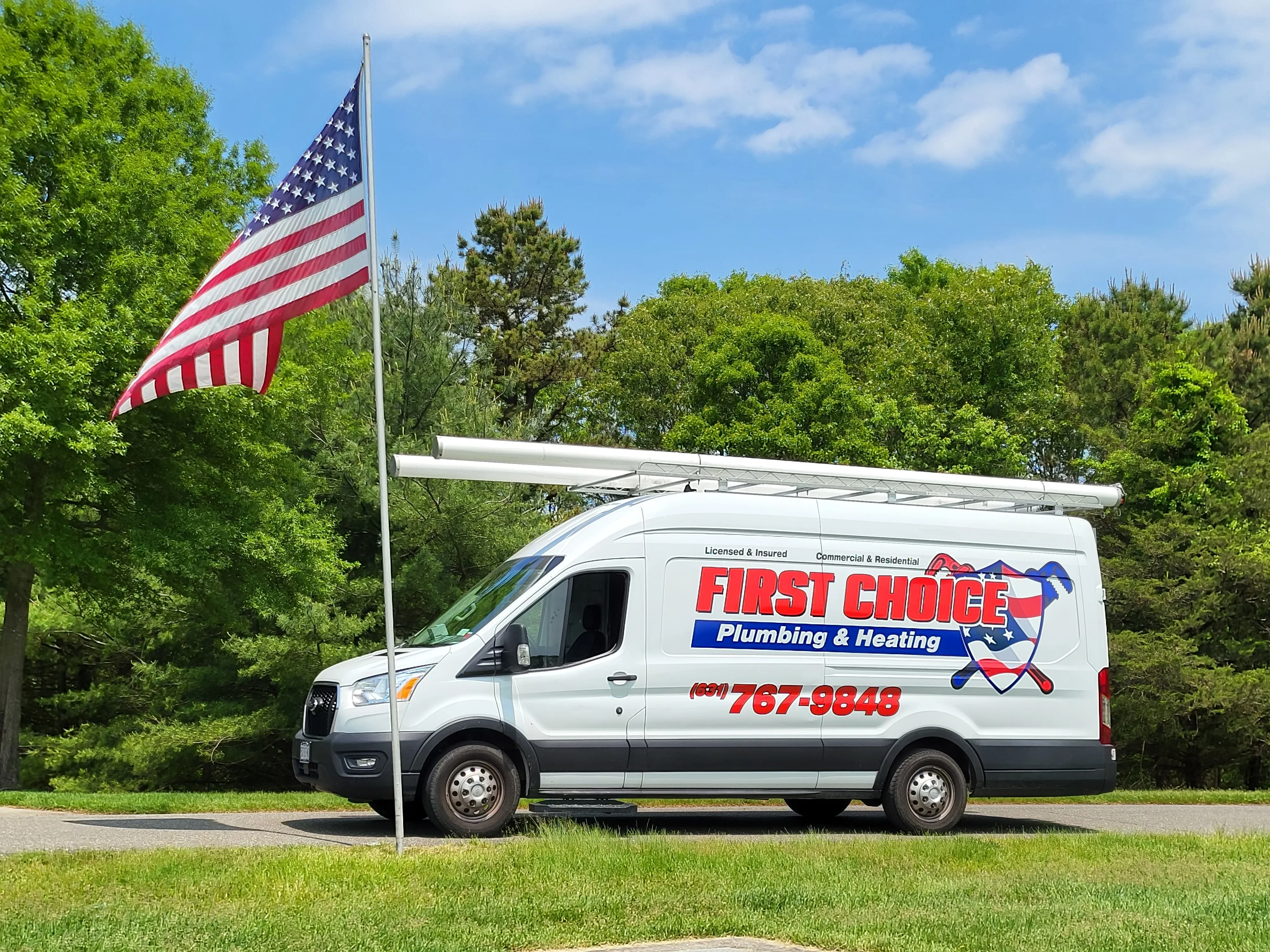 White service van with full-color plumbing company wrap and logo graphics