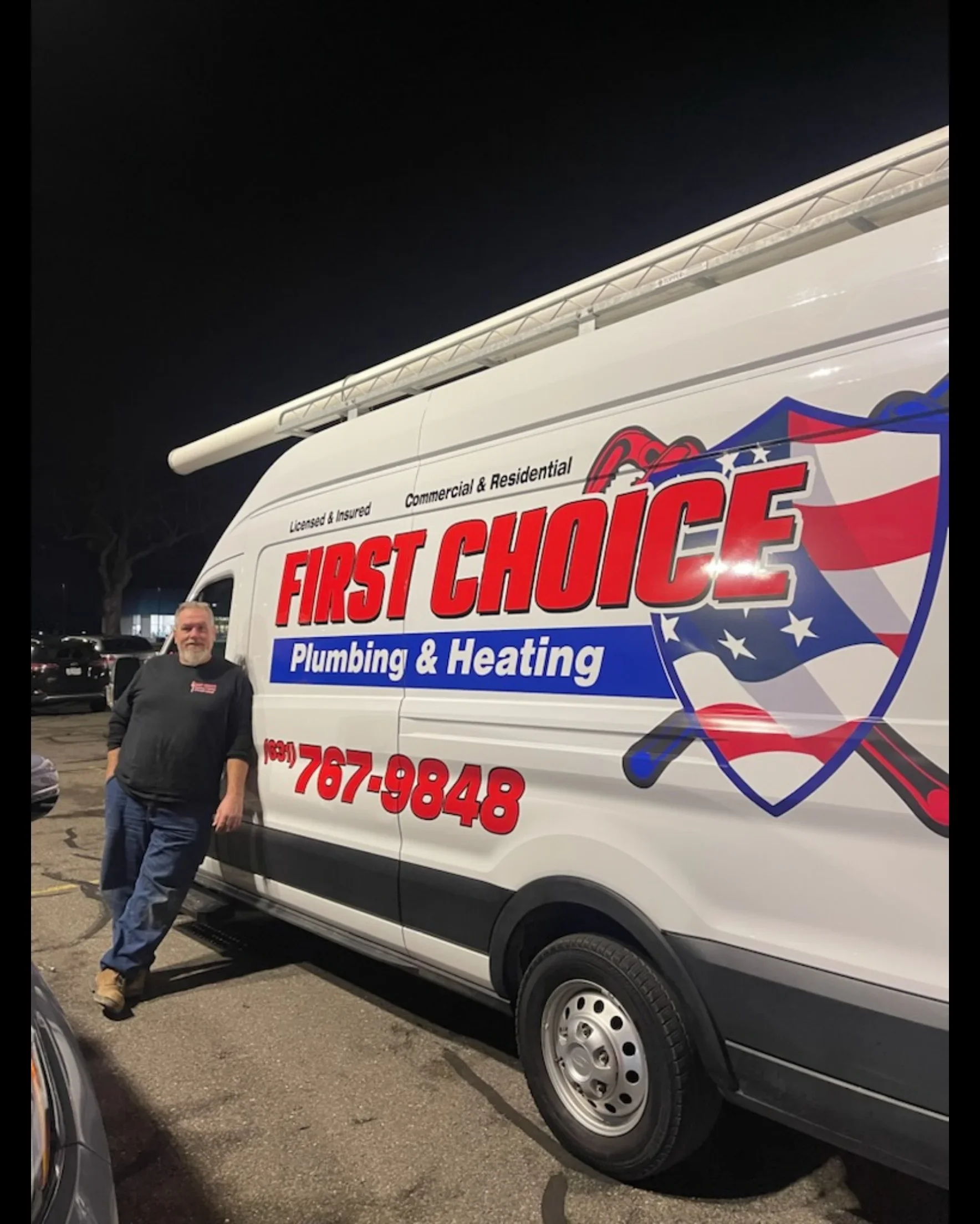 White service van with red and blue vinyl wrap, patriotic shield logo, and company branding
