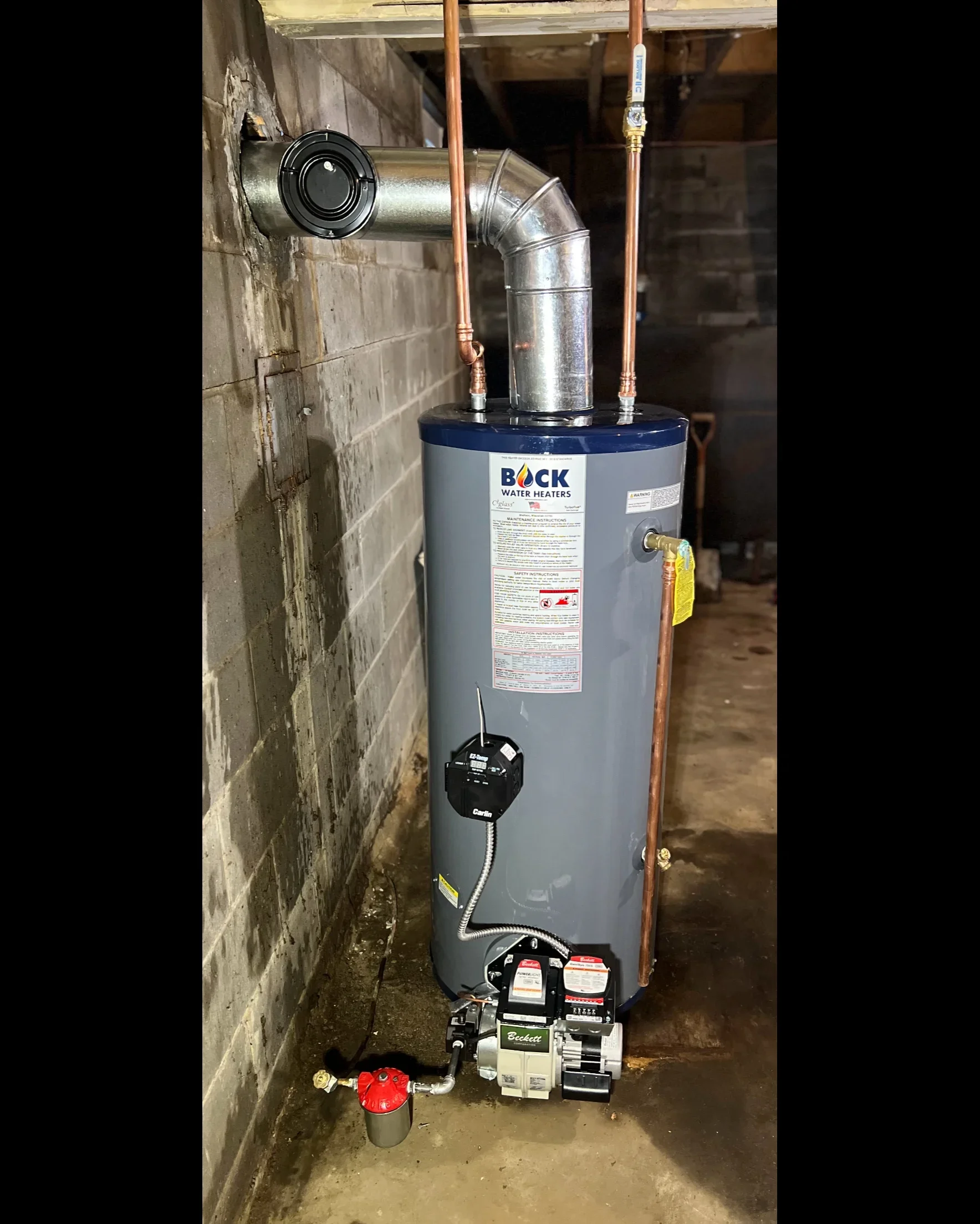 Bock water heater with copper piping, metal vent system, and pressure relief valve installation